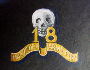 The approved collar badge for the 18th Manitoba Armoured Car Regiment. LAC RG 24 Vol 2266 File HQ 54-28-1043-2.