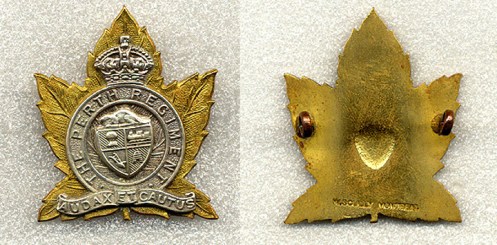A three piece Scully made badge. Also using lugs, this version has the coat of arms as a separate 3rd piece. The depression in the centre of the badge is a result of the manufacturing process. It is stamped W Scully Montreal at the bottom of the badge.