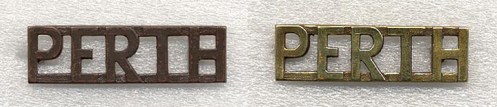 Left, Bronze shoulder title  Right, Brass shoulder titles