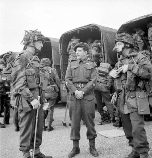 Can Para June 44 e002852749 v6.jpg Preparing for their Normandy descent, these soldiers wear Helmets, Steel, Airborne Troops Mk.I heavily covered with netting and scrim.