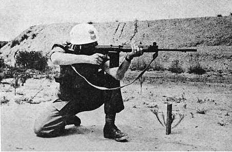 This photograph from a pamphlet on musketry instruction shows a another white airborne helmet, with rank insignia.