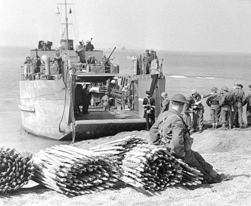 From the Yukon series of exercises that were held at the tiny fishing harbour of West Bay on the coast near Bridport, Dorset, bundles of chespaling, used for laying a track to enable disembarking tanks to cross the beach, can be seen on the left. These bundles weighed approximately 250 pounds, were 25 feet long. Source: Authors’ collection.