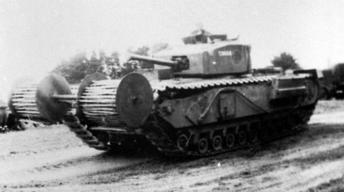 Another view of the “Beach Track Laying Device,” during the trails conducted by the Combined Operations Experimental Establishment. Note the position of the roll of chespaling, which was set approximately 24-inches, in front of the track. Source: MilAt photo archives.