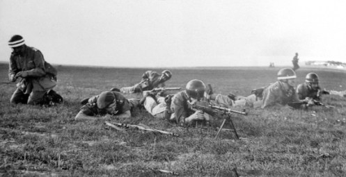 This photograph shows the RCR Company of the MSF exercising at Malton. They appear to be wearing converted DR helmets. Note the white bands which seem to indicate officers.