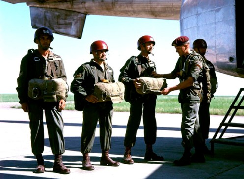 This picture, taken in 1956, shows jump instructor wearing red helmets, with rank insignia.