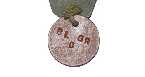 Rear view of Pte Little's red disc. The inclusion of a blood group is unusual.