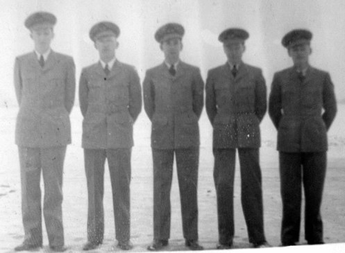 Opening day at #9 EFTS with Instructor Charlie Harrod in the middle. Cam Harrod collection Note that the uniforms lack any insignia as they were not designed yet 
