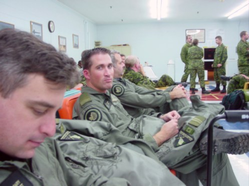 Team members attend a briefing. The subdued pattern is shown in wear. Author's collection