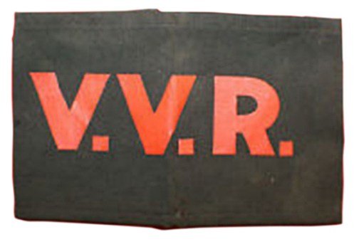 The basic VVR armband, manufactured by the Northwestern Manufacturing Co., and featuring a sinmple black cotton band with silk-screened lettering. The armband is joined by two elastic bands at the rear. Courtesy Marway Militaria