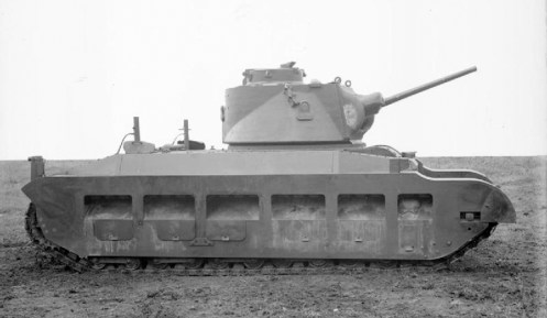 A right-side view of the pilot model Infantry Tank Mark II, Matilda II (A12), A12EA1, while undergoing trails at the British Mechanization Experimental Establishment. A12EA1, was powered by twin commercial AEC straight six-cylinder water-cooled diesel engines, making the Infantry Tank Mark II, Matilda II (A12), the first British tank in service to use diesel engines. Source: IWM (KID 1542).