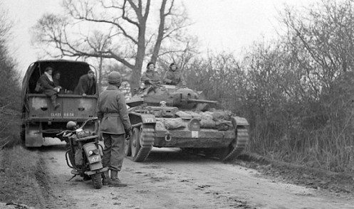 A Covenanter IV, of Headquarters, 1st Canadian Army Tank Brigade, passing troops of an unidentified Canadian unit, while on exercise, somewhere in the United Kingdom. Source: MilArt photo archive.