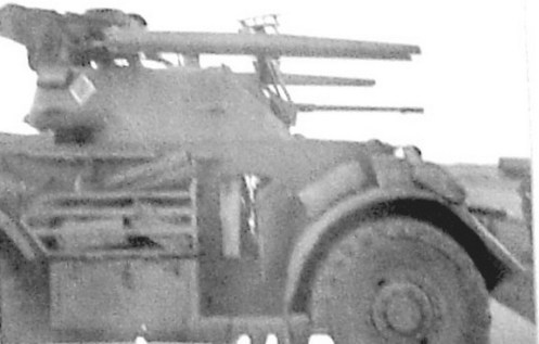 Photographs from First Canadian Army’s Weapons Technical Staff Officer Major Sangster’s report showing the rails fitted to a XII Manitoba Dragoons Staghound.The vehicle bares the tac sign of the HQ Company] 