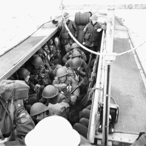 Infantrymen of Le Regiment de la Chaudiere alongside HMCS Prince David, off the coast of England, 9 May 1944.