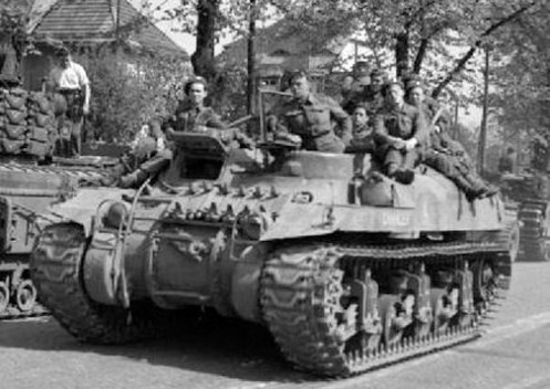 An example of a ‘Ram’ Kangaroo armoured personnel carrier, with ‘Vertical Volute Spring’ suspension, which has the return roller mounted on top of the bogie assembly. IWM (BU 4515)