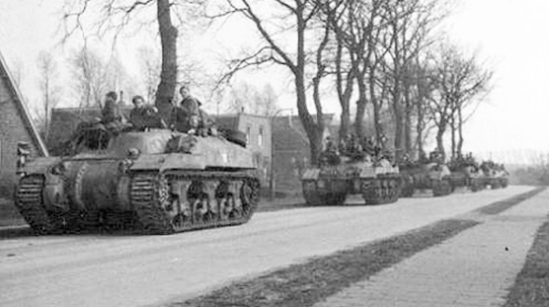 No. 1 Troop, “A” Squadron, 1st Canadian Armoured Personnel Carrier Regiment, carrying infantrymen of “B” Company, The Royal Hamilton Light Infantry, 4th Canadian Infantry Brigade, advancing on Groningen, Holland, on the morning of 13 April 1945. Source: 1 CACR Association & Archive