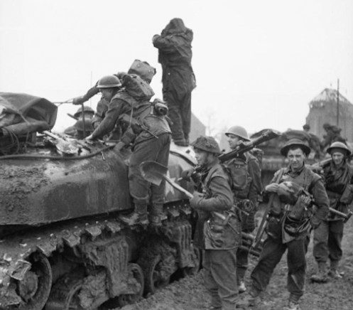 Infantrymen of the British 3rd Infantry Division loading onto Kangaroos of the 49th Armoured Personnel Carrier Regiment, Royal Armoured Corps, prior to an attack on Kervenheim, Germany, 2 March 1945. Source: Imperial War Museum (B 14972)