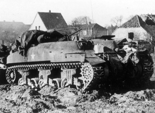 A ‘Ram’ Kangaroo armoured personnel carrier of the 1st Canadian Armoured Personnel Carrier Regiment. Note the forward facing secondary .30-calibre Browning machine gun mounted in the turret ring, and the vehicle tarpaulin, which as been pulled back from over a ‘tarp/bivouac’ support, which can be seen with one leg mounted in the front of the turret ring, while the other leg is mounted in the rear of the turret ring, with the centre pole of the ‘tarp/bivouac’ support, in between. Source: 1 CACR Association & Archive