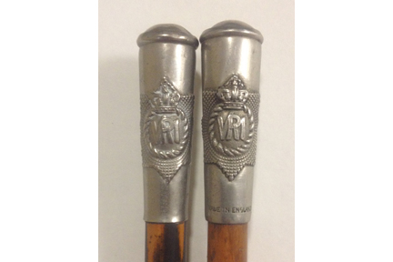 Two swagger sticks of The RCR with the proper Regimental Crest. Although similar in construction, the stick on the right has a “Made in England” stamp.