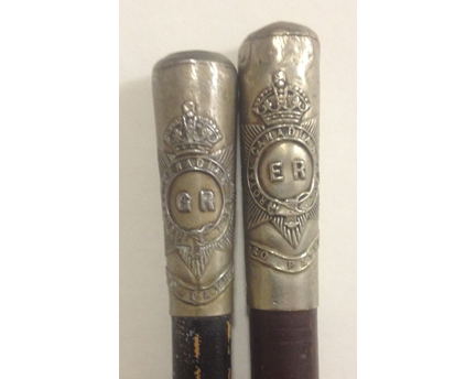 Two swagger sticks with improper Regimental Crests. On left a George V Pattern from 1910-1936, and Edward VII 1901-1910 on right. 