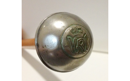 A 1960’s style RCR swagger stick with what appears to be a button being used as the Regimental crest. The round knob measures 1 ¼ inches in diameter, and 27 inches long. Author's collection