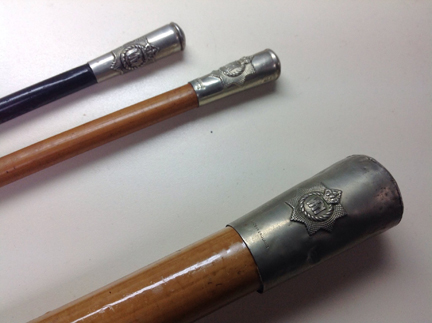 A selection of sticks used by The RCR.  From left to right, an Officer’s dark Malacca, an OR/NCOs sand Malacca stick, and a Senior NCO’s drill cane as per the 1967 Regimental Standing Orders.