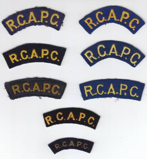 Several varieties of R.C.A.P.C. abbreviated titles. Primrose yellow was open to interpretation, as can be seen in the different colours of embroidery. The bottom title is made in bullion wire. Authors collection.